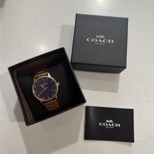 Coach women’s Gold Watch with Blue Dial